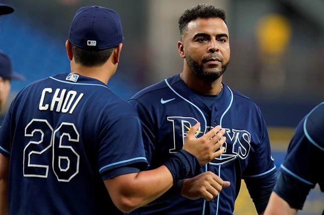 Tampa Bay Rays' Nelson Cruz celebrates with Ji-Man Choi (26) after the Rays defeated the Baltimore Orioles during a baseball game Tuesday, Aug. 17, 2021, in St. Petersburg, Fla. (AP Photo/Chris O'Meara)