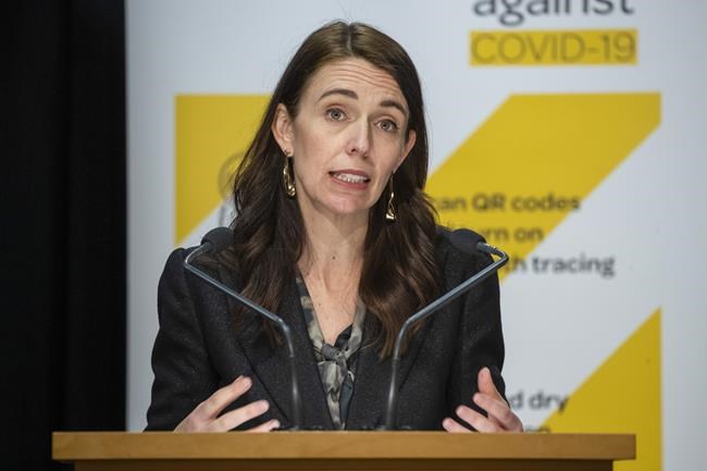 New Zealand Prime Minister Jacinda Ardern gives a COVID-19 response update at Parliament, Wellington, New Zealand, Wednesday, Aug. 18, 2021. Ardern announced people will be compelled to wear masks in supermarkets, gas stations and pharmacies during strict lockdowns. That came after the government on Tuesday imposed a strict lockdown of at least three days for the entire country and at least seven days in Auckland and Coromandel after identifying the first infection. (Mark Mitchell/New Zealand Herald via AP)