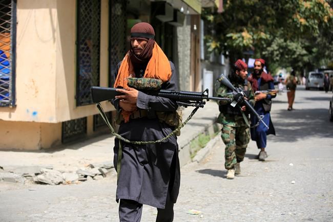 Taliban fighters patrol in Wazir Akbar Khan in the city of Kabul, Afghanistan, Wednesday, Aug. 18, 2021. The Taliban declared an