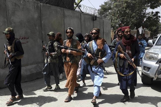 Taliban fighters patrol in Wazir Akbar Khan neighborhood in the city of Kabul, Afghanistan, Wednesday, Aug. 18, 2021. The Taliban declared an
