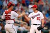 Washington Nationals relief pitcher Kyle Finnegan (67) celebrates with catcher Riley Adams (25) after a baseball game against the Toronto Blue Jays, Wednesday, Aug. 18, 2021, in Washington. The Nationals won 8-5. (AP Photo/Nick Wass)