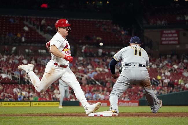 St. Louis Cardinals' Tyler O'Neill, left, is safe at first for a single as Milwaukee Brewers first baseman Rowdy Tellez handles the throw during the seventh inning of a baseball game Wednesday, Aug. 18, 2021, in St. Louis. (AP Photo/Jeff Roberson)