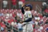 Milwaukee Brewers starting pitcher Freddy Peralta pauses after giving up an RBI single to St. Louis Cardinals' Lars Nootbaar during the first inning of a baseball game Wednesday, Aug. 18, 2021, in St. Louis. (AP Photo/Jeff Roberson)