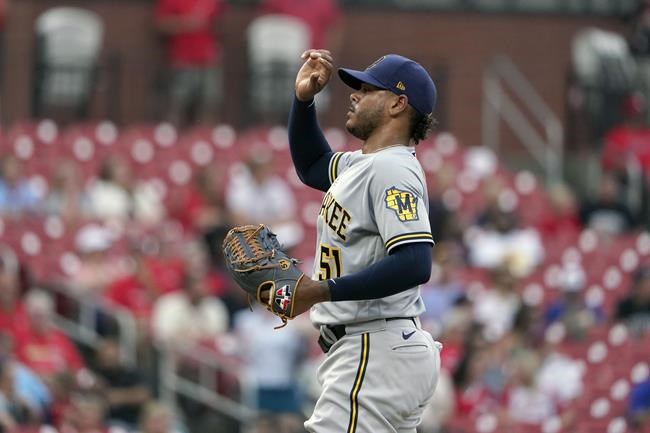 Milwaukee Brewers starting pitcher Freddy Peralta pauses after giving up an RBI single to St. Louis Cardinals' Lars Nootbaar during the first inning of a baseball game Wednesday, Aug. 18, 2021, in St. Louis. (AP Photo/Jeff Roberson)