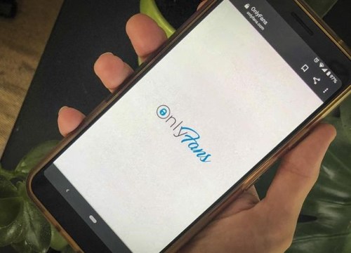 This photo shows a phone app for OnlyFans, a site where fans pay creators for their photos and videos, Thursday Aug. 19, 2021. A spokesperson says the site will ban 