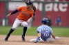 Kansas City Royals' Andrew Benintendi (16) is caught stealing second by Houston Astros shortstop Carlos Correa (1) during the fourth inning of a baseball game Thursday, Aug. 19, 2021, in Kansas City, Mo. (AP Photo/Charlie Riedel)