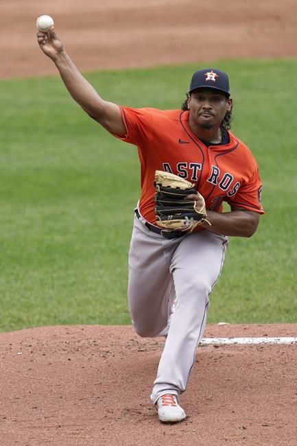 Houston Astros starting pitcher Luis Garcia throws during the first inning of a baseball game against the Kansas City Royals Thursday, Aug. 19, 2021, in Kansas City, Mo. (AP Photo/Charlie Riedel)