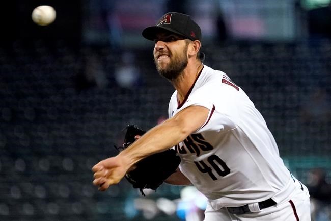 Arizona Diamondbacks starting pitcher Madison Bumgarner throws against the Philadelphia Phillies during the eighth inning of a baseball game, Thursday, Aug. 19, 2021, in Phoenix. (AP Photo/Matt York)