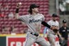 Miami Marlins third baseman Brian Anderson throws out Cincinnati Reds' Jonathan India at first during the first inning of a baseball game Thursday, Aug. 19, 2021 in Cincinnati. (AP Photo/Jeff Dean)
