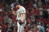 Milwaukee Brewers starting pitcher Brandon Woodruff pauses on the mound after giving up a solo home run to St. Louis Cardinals' Lars Nootbaar during the fifth inning of a baseball game Thursday, Aug. 19, 2021, in St. Louis. (AP Photo/Jeff Roberson)