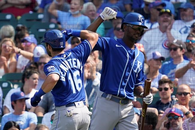 Kansas City Royals' Andrew Benintendi, left, celebrates with Michael A. Taylor after hitting a solo home run in the sixth inning of a baseball game against the Chicago Cubs, Friday, Aug. 20, 2021, in Chicago. (AP Photo/Nam Y. Huh)