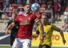 Freiburg's Christian Gunter, left, in a duel with Dortmund's Felix Passlack during the Bundesliga soccer match between SC Freiburg and Borussia Dortmund at Schwarzwald-Stadion in Freiburg, Germany, Saturday Aug. 21, 2021. (Philipp von Ditfurth/dpa via AP)