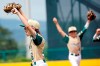 Lake Oswego, Ore.'s Chase Kelly (6) and Crew Corry (4) celebrate after the final out in their 8-2 win against Oaks, Pa. during the sixth inning of a baseball game at the Little League World Series in South Williamsport, Pa., Friday, Aug. 20, 2021. Oregon won the game 8-2. (AP Photo/Tom E. Puskar)