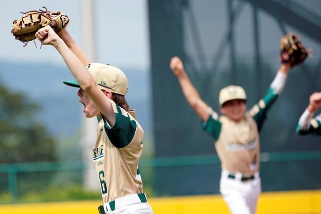 Lake Oswego, Ore.'s Chase Kelly (6) and Crew Corry (4) celebrate after the final out in their 8-2 win against Oaks, Pa. during the sixth inning of a baseball game at the Little League World Series in South Williamsport, Pa., Friday, Aug. 20, 2021. Oregon won the game 8-2. (AP Photo/Tom E. Puskar)
