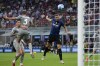 Inter Milan's Edin Dzeko scores his side's fourth goal during the Serie A soccer match between Inter Milan and Genoa, at the San Siro stadium in Milan, Italy, Saturday, Aug. 21, 2021. (AP Photo/Antonio Calanni)