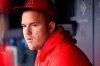 Los Angeles Angels' Mike Trout looks on in the dugout before baseball game against the New York Yankees, Monday, Aug. 16, 2021, in New York. (AP Photo/Noah K. Murray)