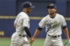 Tampa Bay Rays starter Luis Patino, right, thanks Brandon Lowe after he fielded a ground ball deflected by Patino that was hit by Chicago White Sox's Andrew Vaughn during the fourth inning of a baseball game Saturday, Aug. 21, 2021, in St. Petersburg, Fla. (AP Photo/Steve Nesius)