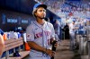 FILE - In this Thursday, Aug. 5, 2021, file photo, New York Mets' Francisco Lindor looks from the dugout before a baseball game against the Miami Marlins, in Miami. Lindor says first-year New York Mets owner Steve Cohen was right to criticize his hitting in a recent tweet. Cohen tweeted Wednesday, Aug. 18 about his struggling ballclub that “it’s hard to understand how professional hitters can be this unproductive.” (AP Photo/Lynne Sladky, File)