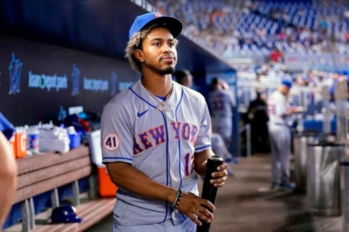 FILE - In this Thursday, Aug. 5, 2021, file photo, New York Mets' Francisco Lindor looks from the dugout before a baseball game against the Miami Marlins, in Miami. Lindor says first-year New York Mets owner Steve Cohen was right to criticize his hitting in a recent tweet. Cohen tweeted Wednesday, Aug. 18 about his struggling ballclub that “it’s hard to understand how professional hitters can be this unproductive.” (AP Photo/Lynne Sladky, File)