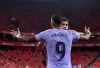 Barcelona's Memphis Depay celebrates with Barcelona's Sergi Roberto after scoring his side's opening goal during the Spanish La Liga soccer match between Athletic Bilbao and Barcelona at San Mames stadium, in Bilbao, northern Spain, Saturday, Aug. 21, 2021. (AP Photo/Alvaro Barrientos)