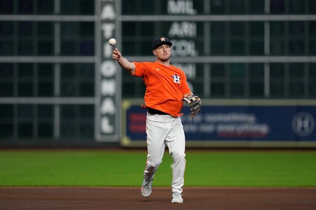 Houston Astros third baseman Alex Bregman fields ground balls before a baseball game against the Seattle Mariners Saturday, Aug. 21, 2021, in Houston. Bregman has been on the injured list. (AP Photo/David J. Phillip)