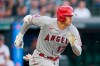 Los Angeles Angels' Shohei Ohtani runs out a ground ball during the first inning of the team's baseball game against the Cleveland Indians, Friday, Aug. 20, 2021, in Cleveland. Ohtani was out. (AP Photo/Tony Dejak)
