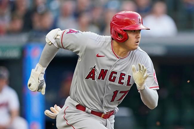 Los Angeles Angels' Shohei Ohtani runs out a ground ball during the first inning of the team's baseball game against the Cleveland Indians, Friday, Aug. 20, 2021, in Cleveland. Ohtani was out. (AP Photo/Tony Dejak)