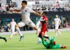 Inter Miami forward Robbie Robinson (19) jumps over Toronto FC goalkeeper Quentin Westberg after scoring a goal during the first half of an MLS soccer match Saturday, Aug. 21, 2021, in Fort Lauderdale, Fla. (AP Photo/Rhona Wise)
