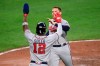 Atlanta Braves' Freddie Freeman, right, is greeted by Jorge Soler at home after they scored on a double by Dansby Swanson during the third inning of a baseball game against the Baltimore Orioles, Saturday, Aug. 21, 2021, in Baltimore. (AP Photo/Nick Wass)