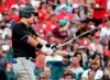 Pittsburgh Pirates' Yoshi Tsutsugo (32) reacts to striking out in the first inning of a baseball game against the St. Louis Cardinals, Saturday, Aug. 21, 2021, in St. Louis. (AP Photo/Tom Gannam)