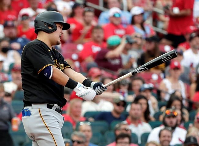 Pittsburgh Pirates' Yoshi Tsutsugo (32) reacts to striking out in the first inning of a baseball game against the St. Louis Cardinals, Saturday, Aug. 21, 2021, in St. Louis. (AP Photo/Tom Gannam)