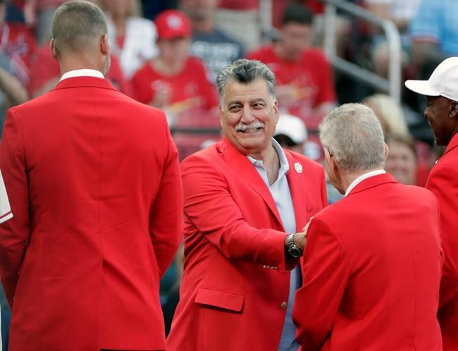 St. Louis Cardinals 2021 Hall of Fame inductee Keith Hernandez is greeted by fellow Hall of Fame members prior to a baseball game against the Pittsburgh Pirates, Saturday, Aug. 21, 2021, in St. Louis. (AP Photo/Tom Gannam)