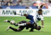 Vancouver Whitecaps' Cristian Dajome, top, and Los Angeles FC's Mamadou Fall collide during the first half of an MLS soccer game in Vancouver, on Saturday, August 21, 2021. THE CANADIAN PRESS/Darryl Dyck