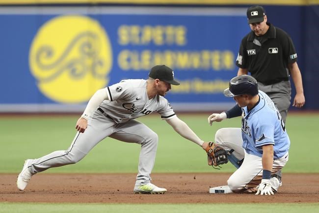 Tampa Bay Rays' Ji-Man Choi, front right, slides in safely to second with a double ahead of a tag from Chicago White Sox shortstop Danny Mendick, left, during the first inning of a baseball game Sunday, Aug. 22, 2021, in St. Petersburg, Fla. (AP Photo/Mike Carlson)