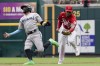 Cincinnati Reds shortstop Jose Barrero (38) tags out Miami Marlins' Miguel Rojas on a ground ball hit by Marlins' Jazz Chisholm Jr. during the fourth inning of a baseball game Sunday, Aug. 22, 2021, in Cincinnati. (AP Photo/Jeff Dean)