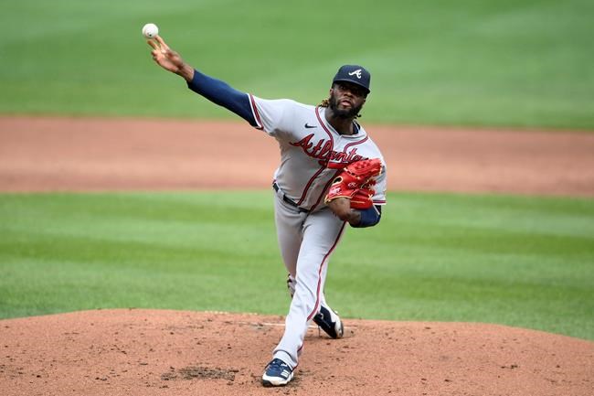 Atlanta Braves starting pitcher Touki Toussaint delivers during the second inning of a baseball game against the Baltimore Orioles, Sunday, Aug. 22, 2021, in Baltimore. (AP Photo/Nick Wass)
