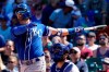 Kansas City Royals' Whit Merrifield watches his sacrifice fly to Chicago Cubs left fielder Ian Happ in the fourth inning of a baseball game Sunday, Aug. 22, 2021, in Chicago. (AP Photo/Nam Y. Huh)