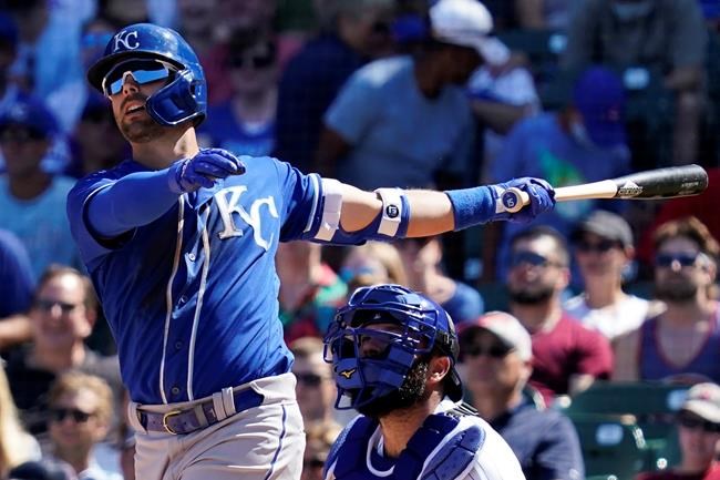 Kansas City Royals' Whit Merrifield watches his sacrifice fly to Chicago Cubs left fielder Ian Happ in the fourth inning of a baseball game Sunday, Aug. 22, 2021, in Chicago. (AP Photo/Nam Y. Huh)