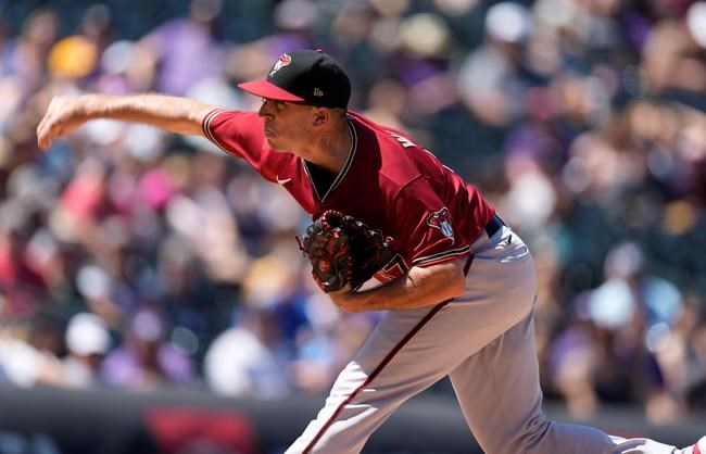 Arizona Diamondbacks starting pitcher Taylor Widener works against the Colorado Rockies in the first inning of a baseball game Sunday, Aug. 22, 2021, in Denver. (AP Photo/David Zalubowski)