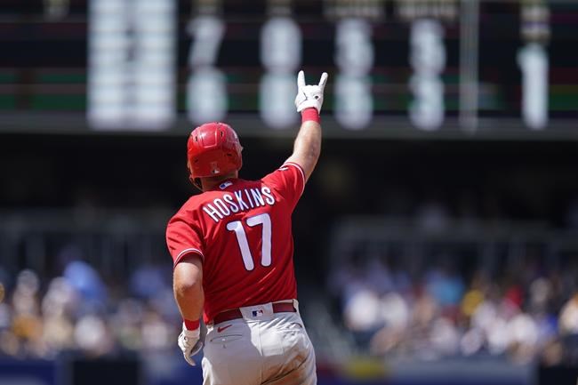 Philadelphia Phillies' Rhys Hoskins reacts after hitting a home run during the fifth inning of a baseball game against the San Diego Padres, Sunday, Aug. 22, 2021, in San Diego. (AP Photo/Gregory Bull)