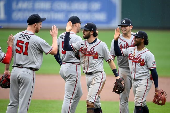 Atlanta Braves' Will Smith (51), Freddie Freeman (5), Dansby Swanson, third from left, Ozzie Albies, right, and others celebrate after a baseball game against the Baltimore Orioles, Sunday, Aug. 22, 2021, in Baltimore. (AP Photo/Nick Wass)