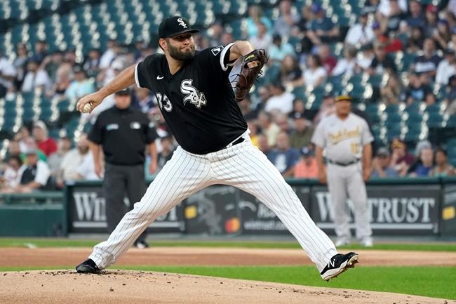 Chicago White Sox starting pitcher Lance Lynn winds up during the first inning of the team's baseball game against the Oakland Athletics on Wednesday, Aug. 18, 2021, in Chicago. (AP Photo/Charles Rex Arbogast)