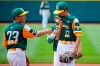 Hastings, Neb., starting pitcher Kowen Rader (12) collects himself on the mound with Benjamin Wibbels (23) during the first inning of a baseball game against Honolulu, Hawaii, at the Little League World Series in South Williamsport, Pa., Sunday, Aug. 22, 2021. (AP Photo/Gene J. Puskar)