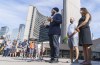 NDP leader Jagmeet Singh responds to questions next to his wife Gurkiran Kaur Sidhu and Mike Layton, son of former NDP leader Jack Layton, in front of City Hall in Toronto , on Sunday, August 22, 2021. THE CANADIAN PRESS/Paul Chiasson