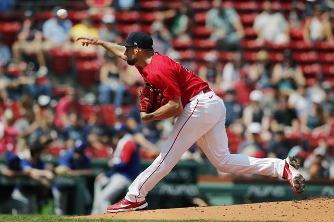 Boston Red Sox's Nathan Eovaldi pitches against the Texas Rangers during the first inning of a baseball game, Monday, Aug. 23, 2021, in Boston. (AP Photo/Michael Dwyer)