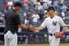 New York Yankees' Andrew Velazquez, right, celebrates with manager Aaron Boone after the Yankees defeated the Minnesota Twins in a baseball game, Saturday, Aug. 21, 2021, in New York. The Yankees won 7-1. (AP Photo/Mary Altaffer)