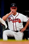 Atlanta Braves manager Brian Snitker watches from the dugout during the team's baseball game against the Cincinnati Reds on Wednesday, Aug. 11, 2021, in Atlanta. (AP Photo/John Bazemore)