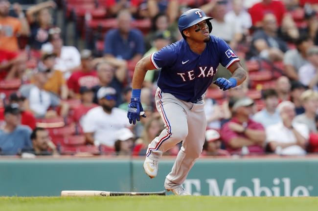 Texas Rangers' Andy Ibanez watches his ground-rule double that drove in two runs during the ninth inning of a baseball game against the Boston Red Sox, Monday, Aug. 23, 2021, in Boston. (AP Photo/Michael Dwyer)
