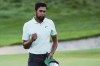Tony Finau celebrates after winning The Northern Trust golf tournament at Liberty National Golf Course Monday, Aug. 23, 2021, in Jersey City, N.J. (AP Photo/John Minchillo)