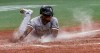 Chicago White Sox's Tim Anderson scores during the 11th inning of a baseball game against the Tampa Bay Rays on Friday, Aug. 20, 2021, in St. Petersburg, Fla. (AP Photo/Steve Nesius)
